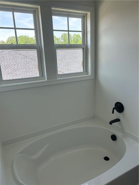 Indulge in a tranquil soak within this well-appoin Indulge in a tranquil soak within this well-appoin