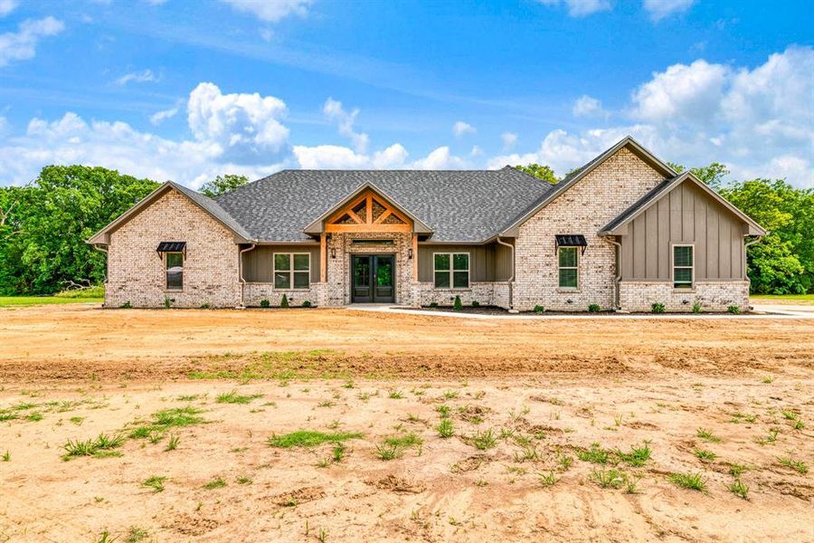 Front exterior of a new home in , Blossom, TX, highlighting curb appeal (Image 24). Front exterior of a new home in , Blossom, TX, highlighting curb appeal (Image 24).