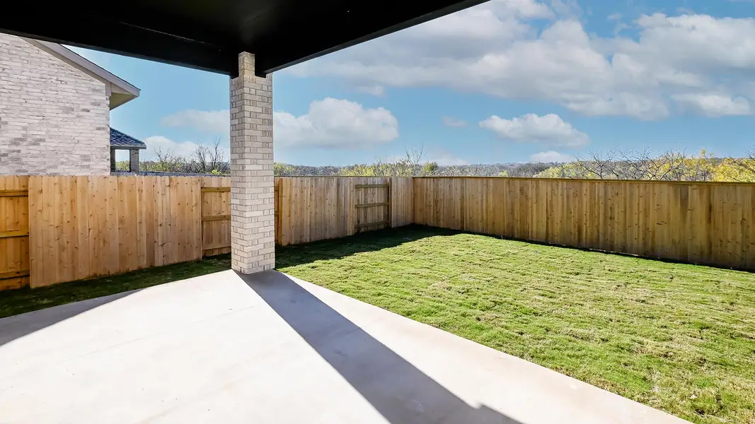 Exterior details and patio area of a home in Crosswinds 50', Kyle (Image 3).