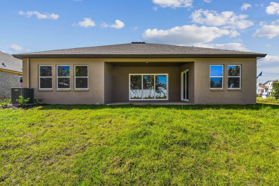 Exterior details and patio area of a home in Pinecone Reserve, Brooksville (Image 35).