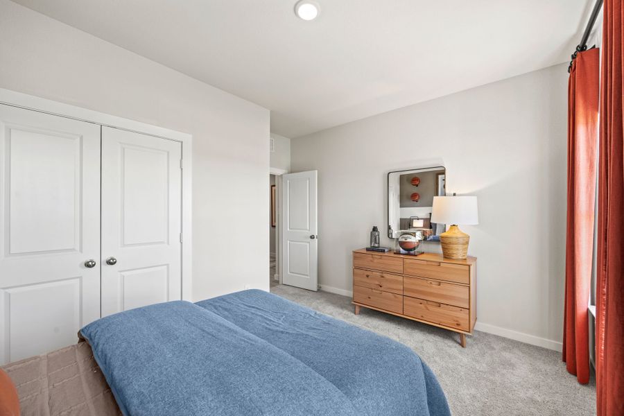 A bedroom with white doors. A bedroom with white doors.