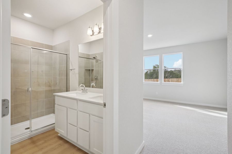 A bathroom with a glass shower.