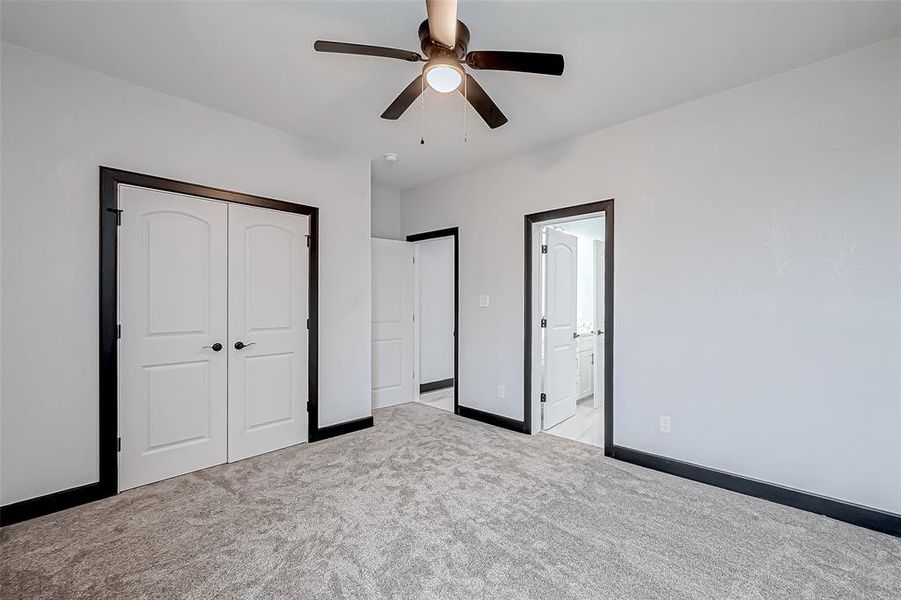 This good-sized room comes with a double-door closet and a fan and shares a full bathroom with another room.