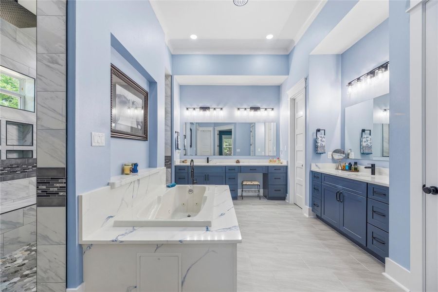 Spa-inspired sanctuary featuring dual vanities, oversized proportions, and sophisticated finishes curated for a five-star experience