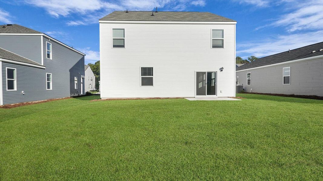 Exterior details and patio area of a home in Pine Hills at Cane Bay, Summerville (Image 2).