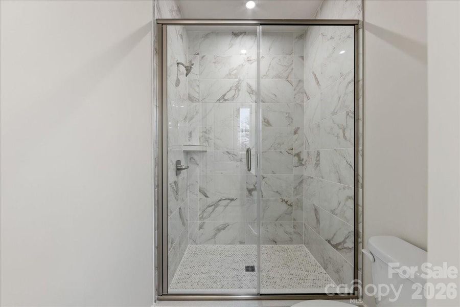 Tiled primary walk-in shower