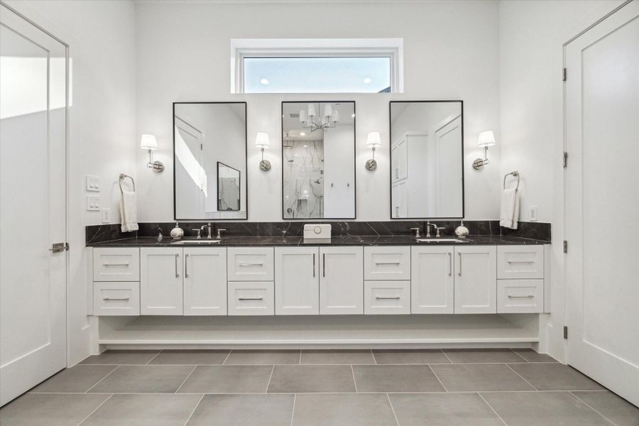 Primary Bath with Pietra Grey Italian marble counters + polished nickel plumbing fixtures Primary Bath with Pietra Grey Italian marble counters + polished nickel plumbing fixtures