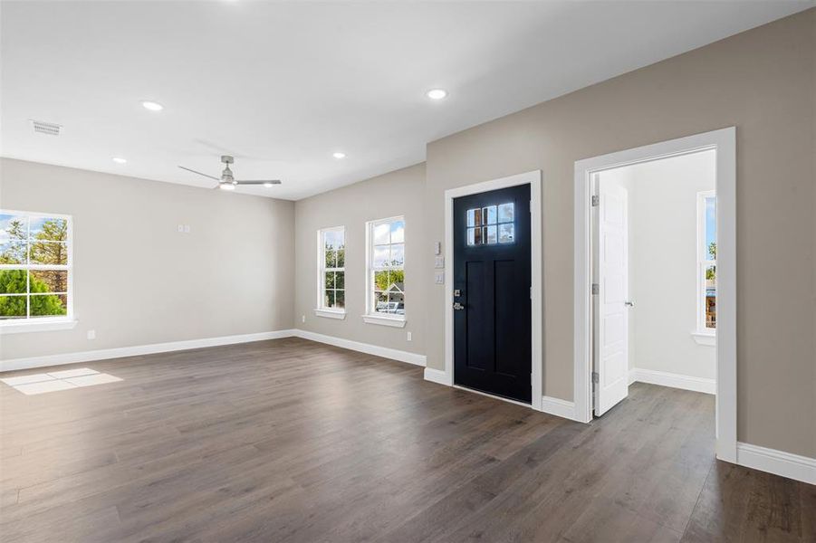 Entrance foyer featuring recessed lighting, dark wood finished floors, and a ceiling fan Entrance foyer featuring recessed lighting, dark wood finished floors, and a ceiling fan