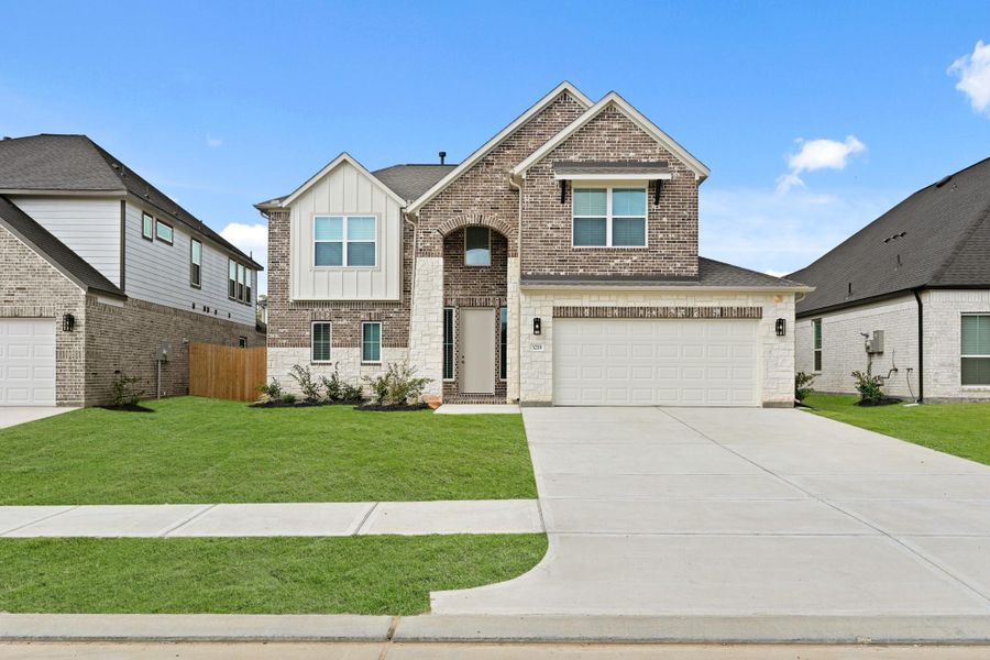 Front exterior of a new home in Barton Creek Ranch, Conroe, TX, highlighting curb appeal (Image 2). Front exterior of a new home in Barton Creek Ranch, Conroe, TX, highlighting curb appeal (Image 2).