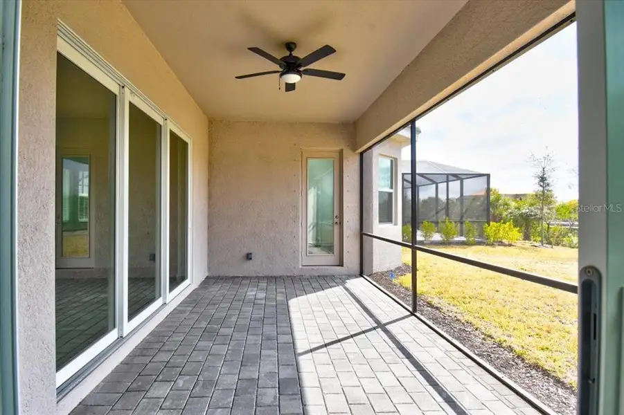 Exterior details and patio area of a home in Harbor East, Port Charlotte (Image 3).