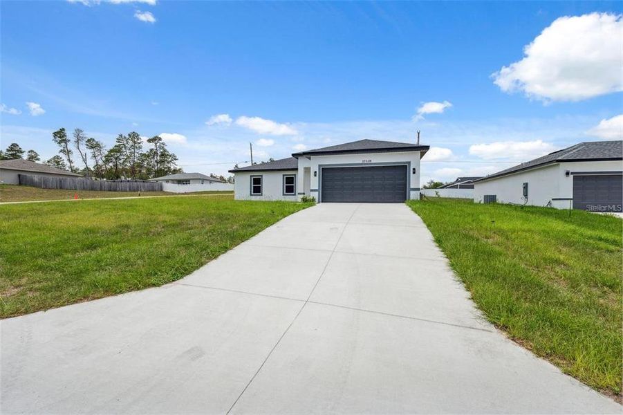 Front exterior of a new home in , Ocala, FL, highlighting curb appeal (Image 25).