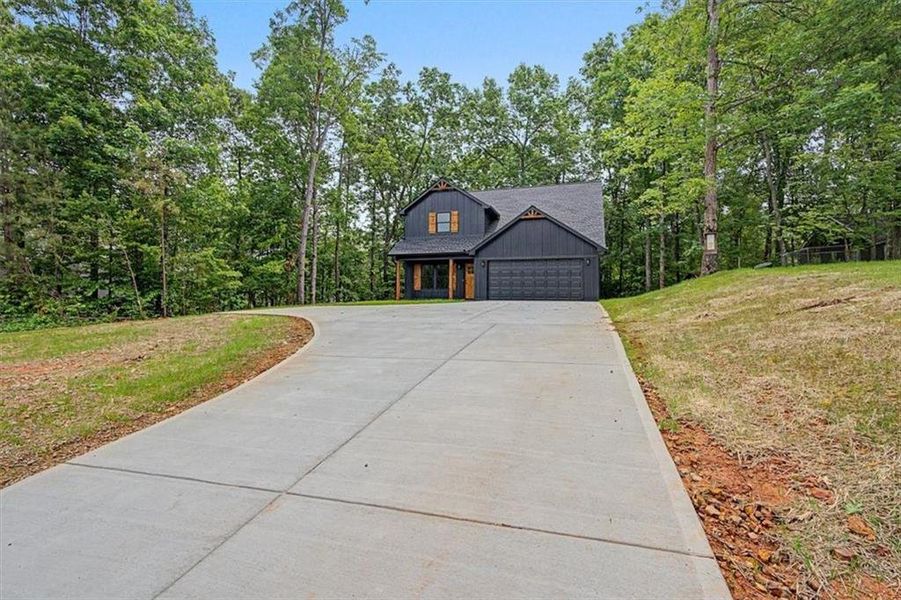 Front exterior of a new home in , Emerson, GA, highlighting curb appeal (Image 16).