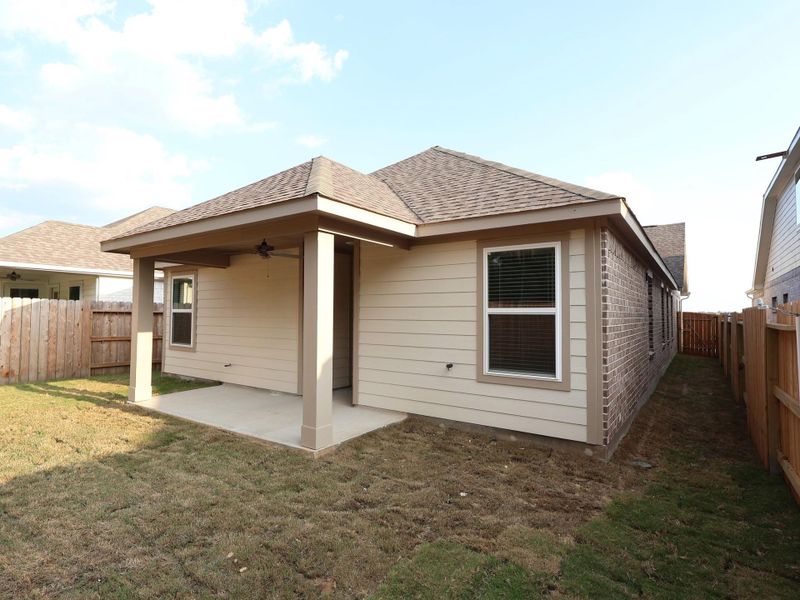 Front exterior of a new home in Sorella, Tomball, TX, highlighting curb appeal (Image 14). Front exterior of a new home in Sorella, Tomball, TX, highlighting curb appeal (Image 14).