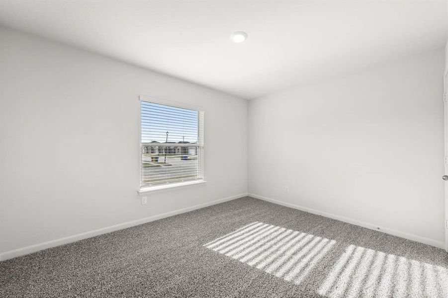 Empty room with carpet flooring