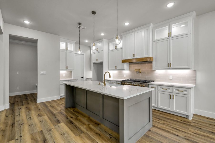 Custom cabinetry (reaching to all the way to the ceiling) with soft close doors and drawers allows for ample storage options. Custom cabinetry (reaching to all the way to the ceiling) with soft close doors and drawers allows for ample storage options.