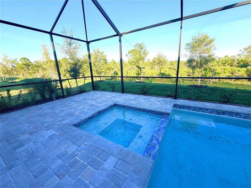 Exterior details and patio area of a home in Island Lakes at Coco Bay: Manor Homes, Englewood (Image 8).