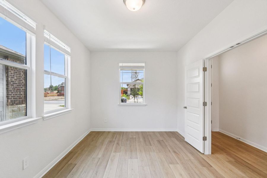 Unfurnished bedroom featuring light wood-type flooring and baseboards Unfurnished bedroom featuring light wood-type flooring and baseboards