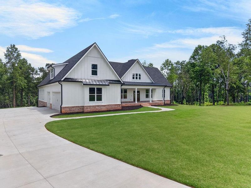 Front exterior of a new home in , Fairmount, GA, highlighting curb appeal (Image 2). Front exterior of a new home in , Fairmount, GA, highlighting curb appeal (Image 2).