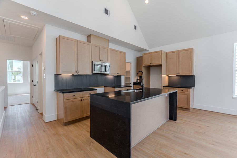 This stylish open concept kitchen, ideal for entertaining, exemplifies modern living in a vibrant community.Photo Disclaimer: Photos are representative of the community and may depict a similar floor plan, model home, or previously completed residence. This stylish open concept kitchen, ideal for entertaining, exemplifies modern living in a vibrant community.Photo Disclaimer: Photos are representative of the community and may depict a similar floor plan, model home, or previously completed residence.