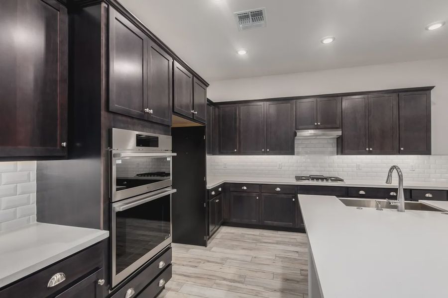 Furnished interior view inside a new home in Valencia at Granite Vista, Waddell (Image 9).