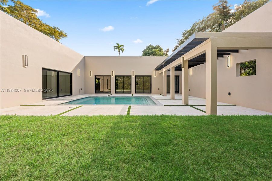 Exterior details and patio area of a home in , North Miami (Image 35).