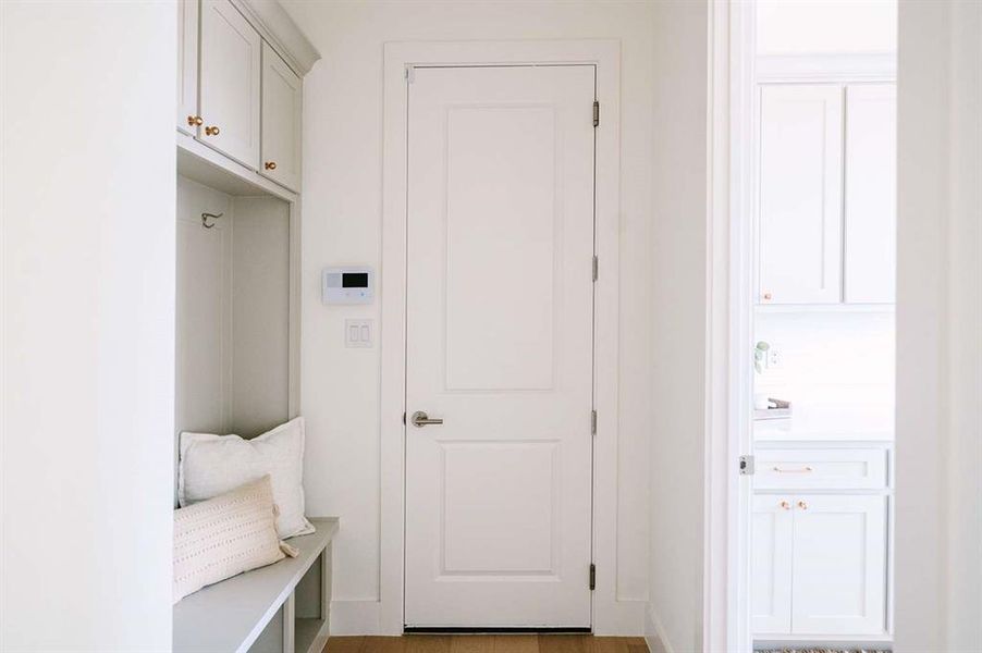 Mudroom featuring hardwood / wood-style floors