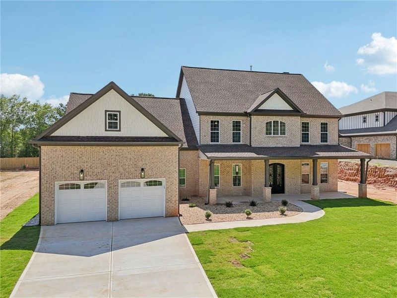 Front exterior of a new home in , Lilburn, GA, highlighting curb appeal (Image 33).