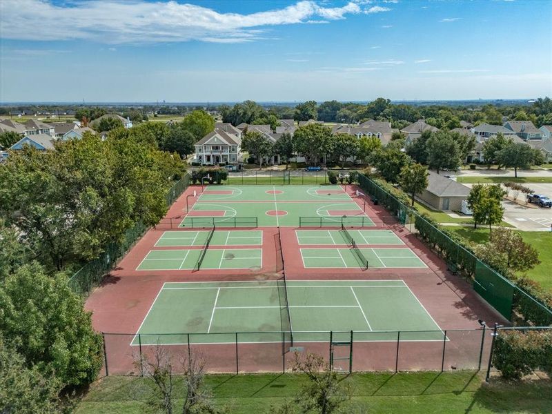 View of tennis court with a residential view View of tennis court with a residential view
