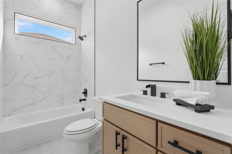 Bathroom with vanity and shower / bathtub combination