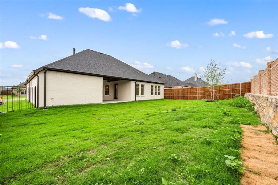 Front exterior of a new home in LeTara, Haslet, TX, highlighting curb appeal (Image 18).