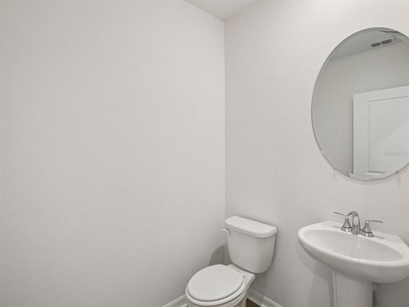 Furnished interior view inside a new home in The Grove at Stuart Crossing - Classic Series, Bartow (Image 13).