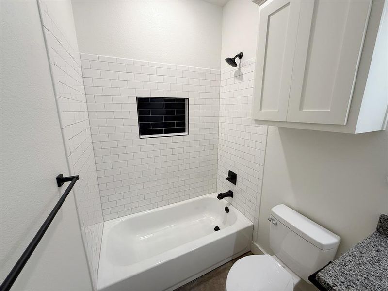 Bathroom with toilet and  shower combination