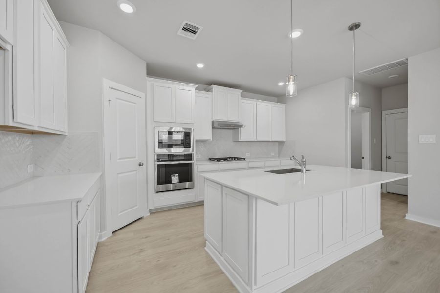 Furnished interior view inside a new home in Sunterra 40, Katy (Image 8).