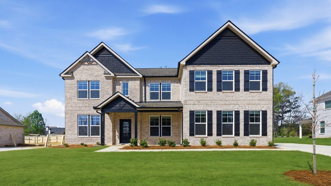 Representative exterior photo of a completed home built from the Clarity by DRB Homes in Cambria at Traditions, Hampton, GA (Image 23). Representative exterior photo of a completed home built from the Clarity by DRB Homes in Cambria at Traditions, Hampton, GA (Image 23).