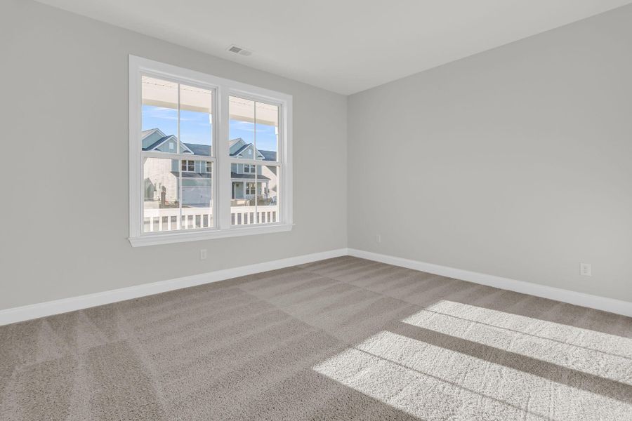 Spacious, unfurnished interior of a new home in Tidewater at Lakes of Cane Bay, Summerville (Image 40).