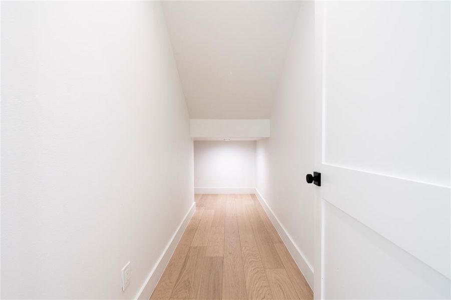 Corridor featuring light hardwood / wood-style flooring