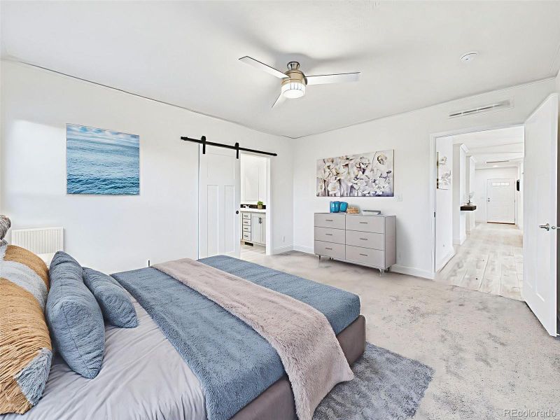 Virtually Staged Alternate view of the primary suite showing ensuite entry and spacious layout. Virtually Staged Alternate view of the primary suite showing ensuite entry and spacious layout.