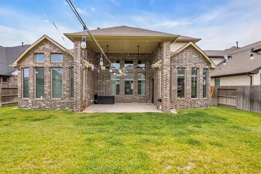 Exterior details and patio area of a home in , Conroe (Image 27).