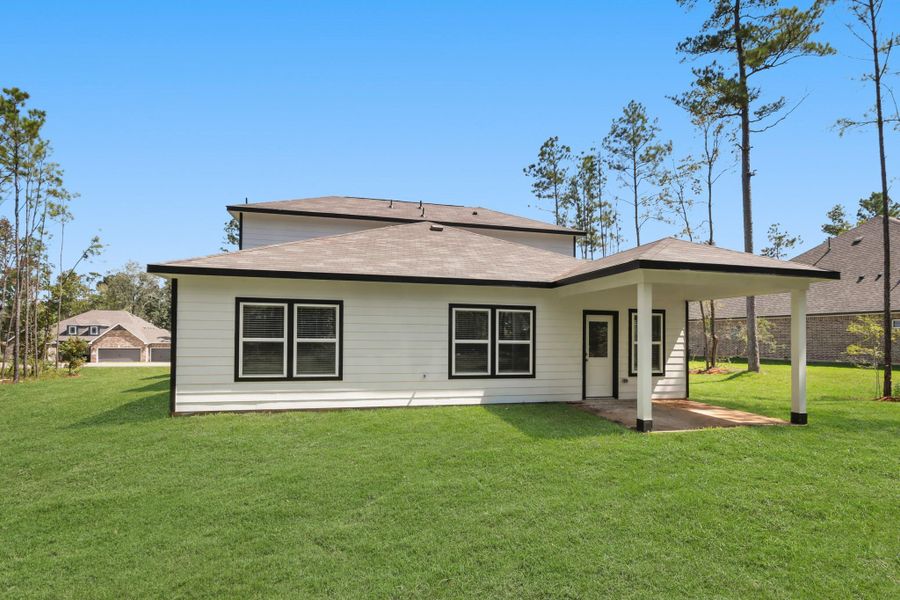 Front exterior of a new home in Oakwood Ranch, Willis, TX, highlighting curb appeal (Image 12). Front exterior of a new home in Oakwood Ranch, Willis, TX, highlighting curb appeal (Image 12).