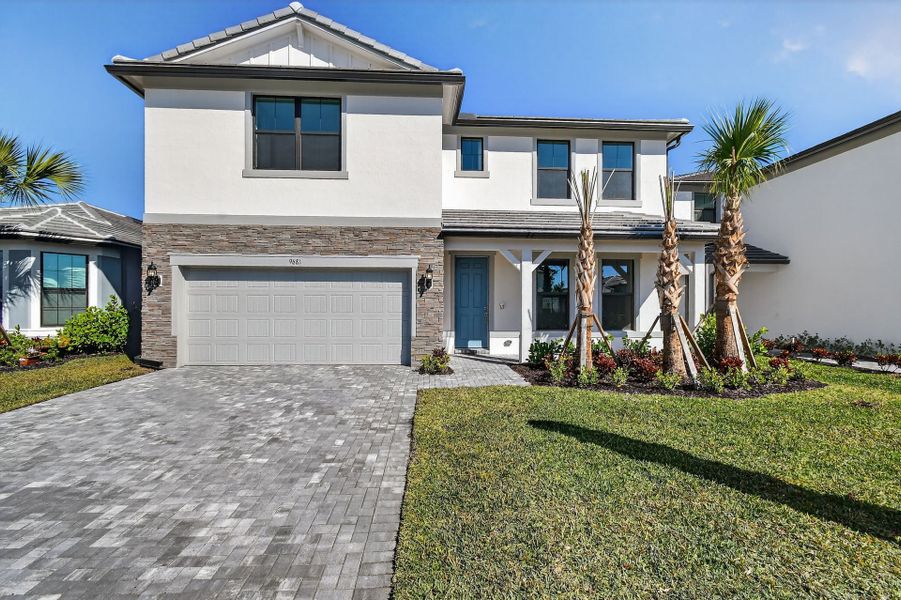 Front exterior of a new home in Hendrix Reserve, Lake Worth, FL, highlighting curb appeal (Image 21).