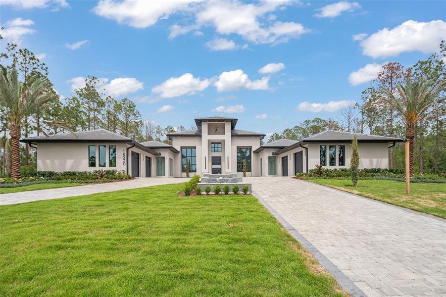 Front exterior of a new home in , Montverde, FL, highlighting curb appeal (Image 39).