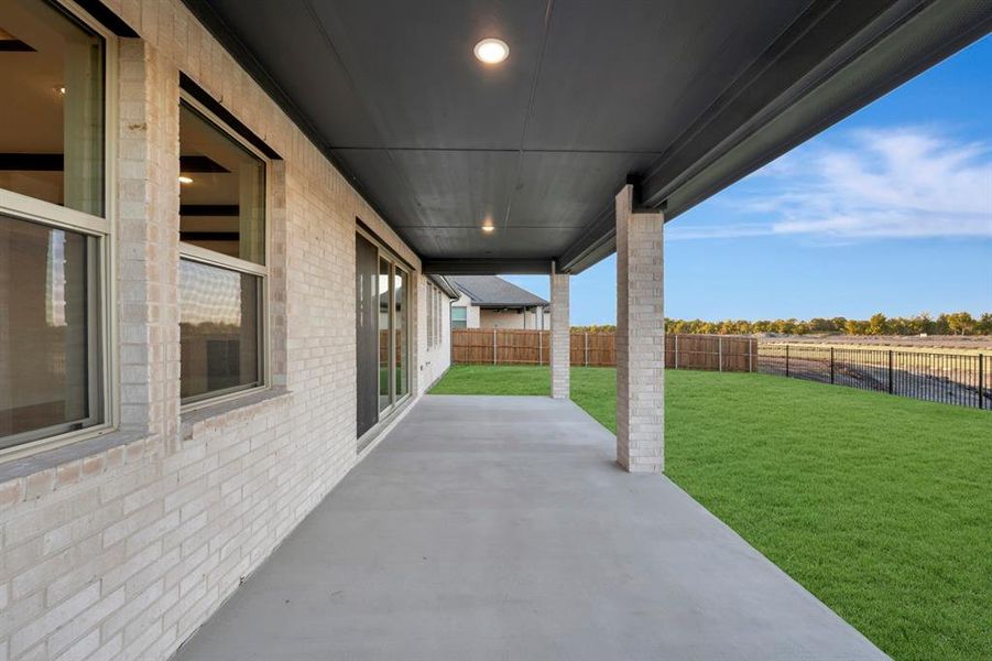 Exterior details and patio area of a home in Elevon, Lavon (Image 3).