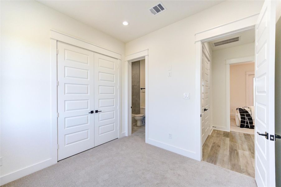 Third Floor secondary bedroom featuring its own private ensuite bathroom.