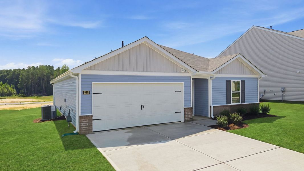 Front exterior of a new home in Hunter Hill, Rocky Mount, NC, highlighting curb appeal (Image 16). Front exterior of a new home in Hunter Hill, Rocky Mount, NC, highlighting curb appeal (Image 16).