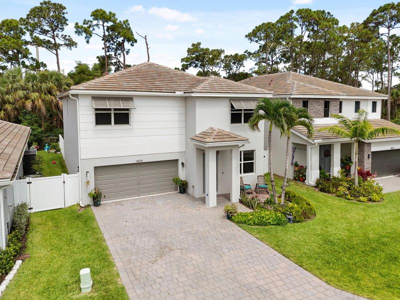 Front exterior of a new home in Reserve at Jupiter, Jupiter, FL, highlighting curb appeal (Image 25).