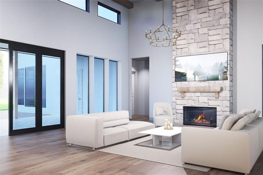 Living area featuring wood finished floors, a fireplace, a high ceiling, and a chandelier