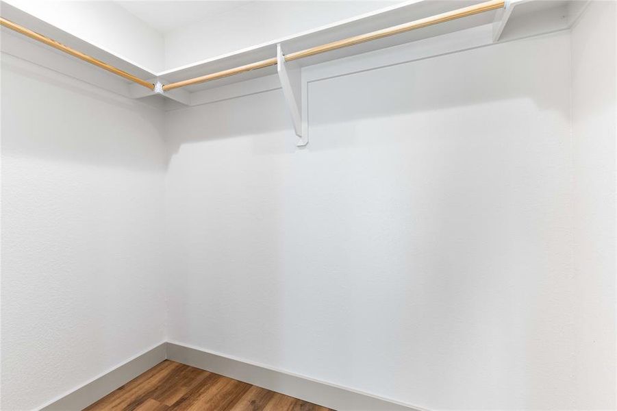 Walk in closet with wood finished floors Walk in closet with wood finished floors