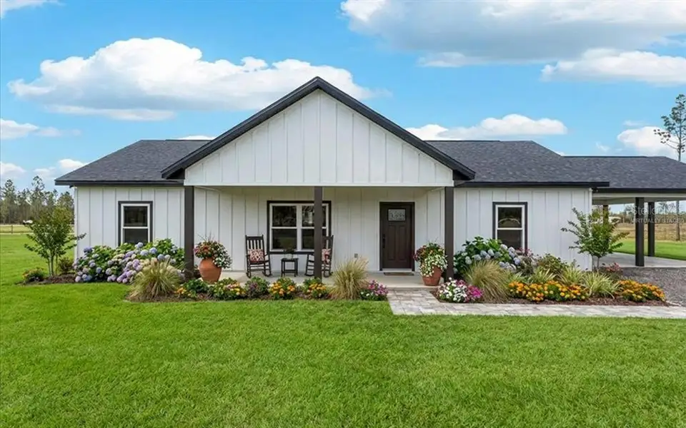 Front exterior of a new home in , Live Oak, FL, highlighting curb appeal (Image 1). Front exterior of a new home in , Live Oak, FL, highlighting curb appeal (Image 1).
