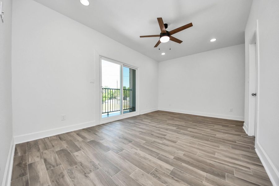 Bedroom 3, facing front of home with outdoor pation
