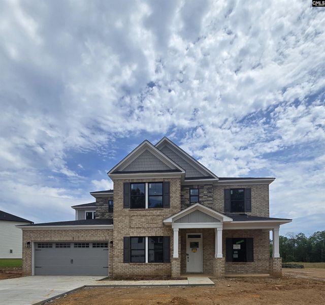 Front exterior of a new home in Collins Cove, Chapin, SC, highlighting curb appeal (Image 1). Front exterior of a new home in Collins Cove, Chapin, SC, highlighting curb appeal (Image 1).